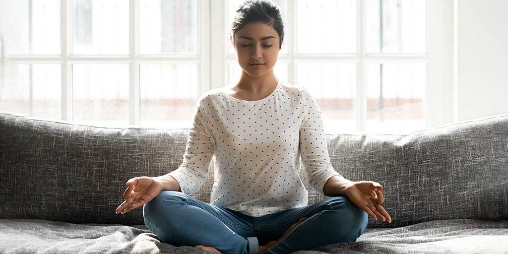 how to be more positive photo of a girl meditating
